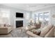 Inviting living room with a fireplace, comfortable seating, and sliding glass doors to a screened porch at 332 Clearpath Dr, Summerville, SC 29486