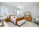 Elegant bedroom with a chandelier, neutral tones, and classic furnishings at 332 Clearpath Dr, Summerville, SC 29486