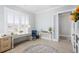 Bright home office with natural light, modern desk, comfortable seating, and stylish decor at 332 Clearpath Dr, Summerville, SC 29486