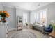 Bright home office with natural light, modern desk, comfortable seating, and stylish decor at 332 Clearpath Dr, Summerville, SC 29486