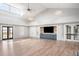 Bright and spacious recreation room with hardwood floors, a TV, and ample seating at 332 Clearpath Dr, Summerville, SC 29486