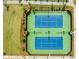 Well-maintained tennis courts with vibrant blue surfaces, surrounded by lush greenery and manicured landscapes at 332 Clearpath Dr, Summerville, SC 29486
