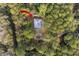 Aerial view of a home nestled amongst lush trees with an arrow pointing toward it at 3348 River Landing Rd, Johns Island, SC 29455