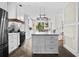 Bright kitchen featuring white cabinets, stone backsplash, a marble island and stainless steel appliances at 3348 River Landing Rd, Johns Island, SC 29455