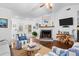 Spacious living room featuring a cozy fireplace and comfortable seating at 3348 River Landing Rd, Johns Island, SC 29455