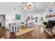 Open-concept living room with modern furnishings, fireplace and hardwood floors at 3348 River Landing Rd, Johns Island, SC 29455