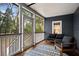 Cozy screened porch with comfortable seating to enjoy the outdoors at 3348 River Landing Rd, Johns Island, SC 29455