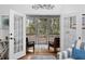 Living room view of a screened porch, providing seamless indoor-outdoor living at 3348 River Landing Rd, Johns Island, SC 29455
