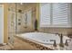 Beautiful bathroom featuring a soaking tub, glass shower, and natural light at 3632 Locklear Ln, Mount Pleasant, SC 29466
