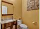 Stylish powder room with a wood vanity, a vessel sink, and elegant fixtures at 3632 Locklear Ln, Mount Pleasant, SC 29466