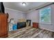 Empty bedroom with hardwood floors, a window, and space for personalization at 3632 Locklear Ln, Mount Pleasant, SC 29466