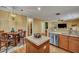 Cozy dining area with a chandelier, wooden table, and a view of the kitchen at 3632 Locklear Ln, Mount Pleasant, SC 29466