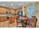 Open dining area featuring wood floors, stainless steel appliances, and a chandelier at 3632 Locklear Ln, Mount Pleasant, SC 29466