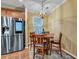 Dining area features wood floors and a modern stainless steel refrigerator at 3632 Locklear Ln, Mount Pleasant, SC 29466
