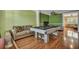 Spacious game room featuring a stylish pool table, wood floors, and neutral decor at 3632 Locklear Ln, Mount Pleasant, SC 29466