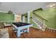 Open game room featuring a stylish pool table, wood floors, and neutral decor at 3632 Locklear Ln, Mount Pleasant, SC 29466