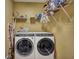 Functional laundry room featuring a modern washer and dryer and ample shelving for storage at 3632 Locklear Ln, Mount Pleasant, SC 29466