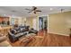 Open-concept living room featuring hardwood floors, ceiling fan, and neutral paint colors at 3632 Locklear Ln, Mount Pleasant, SC 29466