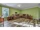 Cozy living room with hardwood floors, crown molding, and a large window at 3632 Locklear Ln, Mount Pleasant, SC 29466