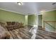 Bright living room with hardwood floors and crown molding, offering a versatile living space at 3632 Locklear Ln, Mount Pleasant, SC 29466
