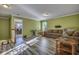 Spacious living room featuring hardwood floors and a view into the dining area at 3632 Locklear Ln, Mount Pleasant, SC 29466