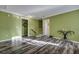 Open living area with hardwood floors and two entryways, perfect for entertaining guests at 3632 Locklear Ln, Mount Pleasant, SC 29466