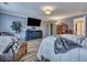 Large, open bedroom featuring sleek flooring, built-in entertainment center, and comfortable seating at 3632 Locklear Ln, Mount Pleasant, SC 29466