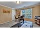 Well-lit office area with a large desk and a relaxing view from the window at 3632 Locklear Ln, Mount Pleasant, SC 29466