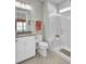 Bright bathroom featuring a vanity with hard surface counters and a glass enclosed walk-in shower with built in seat at 376 Tupelo Lake Dr, Summerville, SC 29486