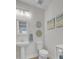 Bathroom with decorative wall art, pedestal sink, and a toilet at 376 Tupelo Lake Dr, Summerville, SC 29486