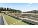 Community bocce ball courts surrounded by lush landscaping and seating areas near the lake at 376 Tupelo Lake Dr, Summerville, SC 29486