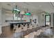 Community catering kitchen featuring stainless appliances, island seating, and dual display screens at 376 Tupelo Lake Dr, Summerville, SC 29486