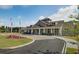 Gorgeous, craftsman-style clubhouse with beautiful landscaping and a circular driveway at 376 Tupelo Lake Dr, Summerville, SC 29486