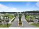 An aerial shot of the community entrance featuring landscaped medians and manicured landscaping at 376 Tupelo Lake Dr, Summerville, SC 29486