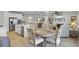 Open dining area with a round table that seamlessly connects to the kitchen and living spaces at 376 Tupelo Lake Dr, Summerville, SC 29486