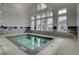Indoor hot tub and seating area surrounded by large windows and ample light at 376 Tupelo Lake Dr, Summerville, SC 29486
