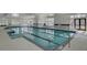 Bright indoor pool with lap lanes, ample natural light and an adjacent hot tub at 376 Tupelo Lake Dr, Summerville, SC 29486