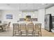 Modern kitchen with a large island, stainless steel appliances, and stylish pendant lighting at 376 Tupelo Lake Dr, Summerville, SC 29486