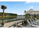 Relaxing lake view from the community patio with lounge chairs and shade at 376 Tupelo Lake Dr, Summerville, SC 29486