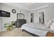 Bright main bedroom featuring tray ceilings, large windows, and neutral décor at 376 Tupelo Lake Dr, Summerville, SC 29486