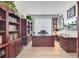Office space featuring wood furniture, built-in shelving, and natural light from the window at 376 Tupelo Lake Dr, Summerville, SC 29486
