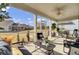 Screened in porch overlooking the lawn with an outdoor sofa, chairs, and a coffee table to enjoy the beautiful view at 376 Tupelo Lake Dr, Summerville, SC 29486