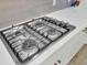 Close-up of a modern stainless steel stove top with sleek knobs and a clean design at 376 Tupelo Lake Dr, Summerville, SC 29486
