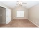 Bright bedroom with neutral paint and large window allows natural light into the living space at 5215 Chicory Ln, North Charleston, SC 29420