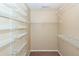 Walk-in closet boasts ample storage space with multiple tiers of white wire shelving at 5215 Chicory Ln, North Charleston, SC 29420