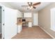 Home office features a built-in desk, storage cabinets, and natural light from a window at 5215 Chicory Ln, North Charleston, SC 29420