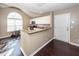Open kitchen with white cabinets, granite counters, and an eat-in bar, perfect for entertaining at 5215 Chicory Ln, North Charleston, SC 29420