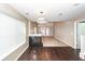 Open living room with a fireplace, hardwood floors, and access to the patio at 5215 Chicory Ln, North Charleston, SC 29420