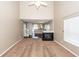 Living room featuring an open layout with views of the fireplace, dining area, and staircase at 5215 Chicory Ln, North Charleston, SC 29420