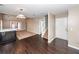 Open-concept living room with a fireplace, hardwood floors, and access to the second floor via stairs at 5215 Chicory Ln, North Charleston, SC 29420